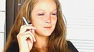 Young lady is smoking her sexy cigarette