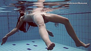 Pretty swimming babe Liza Rachinska shows striptease under the water