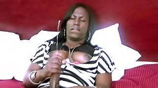 Big cock black tranny in bed and jerking off her sexy dick