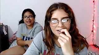 Two nerdy latinas playing with their pussies on cam