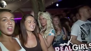 Party girls at the bar dance to the music and flash their tits