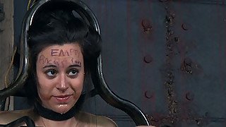 Chubby dark haired teen gets her body fastened in metal cage during BDSM sex play