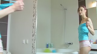 A kinky teen babe fucks her ass with her toothbrush