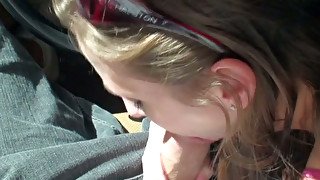 Nasty brunette bimbo gives good blowjob on the front sit of the car