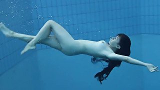 Cute and playful brunette Russian skank in the pool