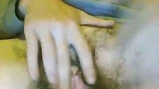 Ugly woman fingering extra hairy vagina in amateur video