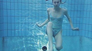 Petite white cute bitch all nude in the pool underwater