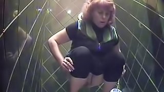 Busty beauty is pissing in the hot toilet