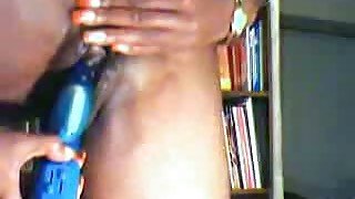 A well-shaped ebony chick masturbating with a dildo on the webcam