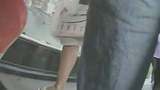 Woman in short dress in the public upskirt footage