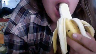 Kinky cam chick acted playfully while sucking banana like a real dick