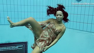 Russian brunette teen shading attire in the pool lovely