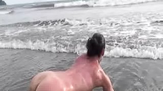 Hot brunette sex bomb does naked yoga on a gorgeous beach