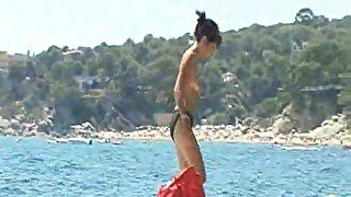 Group of naked chicks play Frisbee and on nude beach - spy cam
