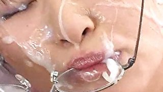 Japanese bukkake whore gets sperm on her glasses! (censored)