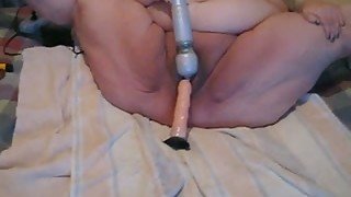 My fat mature wife plays with two dildos in homemade solo clip