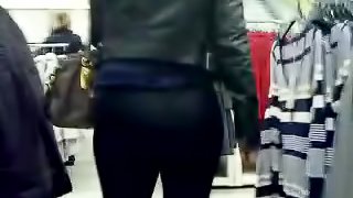 Big-assed chick wearing legging caught on camera in a shop