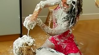 Cans of shaved cream emptied onto fully clothed ladies