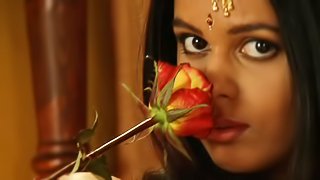 Erotic Indian chick is playing with flowers