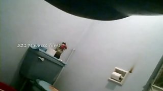 Pissing girls are filmed in the bathroom