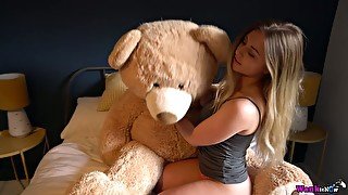 Libidinous beauty Sophie K is playing with her favorite big teddy bear
