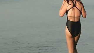 Sexy swimsuit on hot mulatto chick at the beach