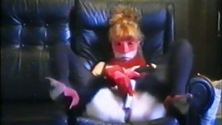 Mature redhead wife masturbates on the couch in the mask