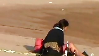 Voyeur tapes a crazy girl riding her bf upskirt at the beach