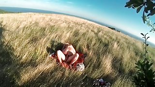 Couple makes a sextape in a field in nature