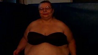 Fat and slutty blonde granny on webcam showing her huge tits