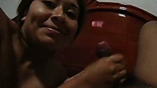 Kinky dark skinned Desi MILF gets her oiled pussy massaged