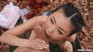 Adorable Asian girl with pierced nipples gets fucked outdoors