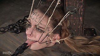 Poor submissive Jessica Kay is put into the wooden barrel and treated hard