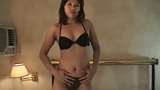 Hot tanned Asian fondling her pussy