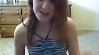 American girl gets naked and masturbates with a vibrator on a chair