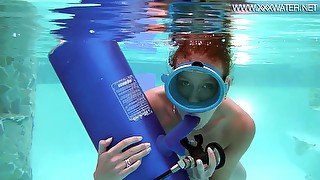 Seductive diver Minnie Manga sucks a suction cup dildo under the water