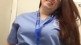 Nurse showing her pierced nipples