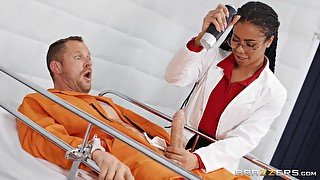 A black nurse wanks a prisoner's big white cock before taking it vaginally