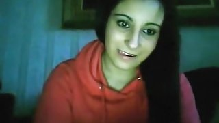 Hot brunette girl flashes her tits on cam, plays with them and masturbates.