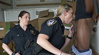 One black submissive dude fucks duo of spoiled police hotties in the storage room