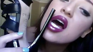 Goth cam chick with cute face licks her new high heel shoes