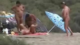 Two mature couples having fun at nude beach