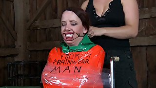 Busty dominatrix is having fun with her helpless slave