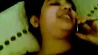 An Indian GF of my cousin talks on phone to her mom as she gets fucked by him