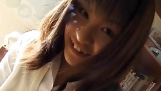 Eri Ueno in sexy uniform sucks cock over boxers until gets cum