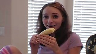 She eats banana and teases camera with gentle bites and licking