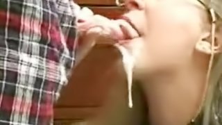 Innocent looking milf sucks a huge pipe and gets an oral creampie from it.