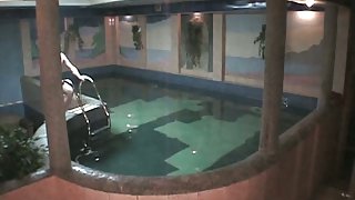 Naked amateur couple having sex in the pool in free voyeur clip