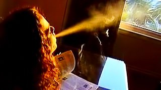 Curly beauty masturbates while smoking