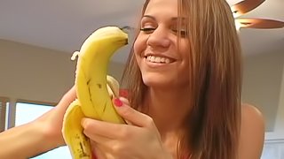 Girl Eating A Banana.